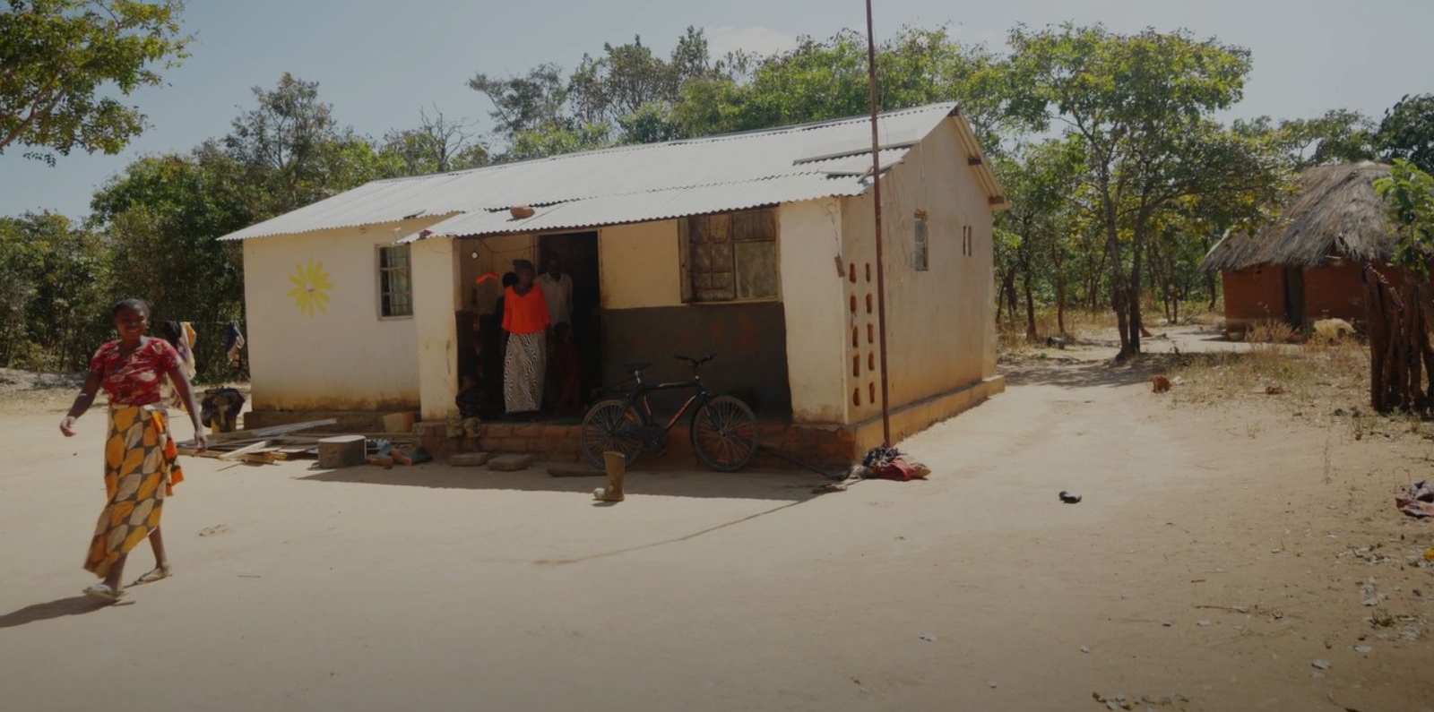 farmer in front of the house